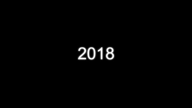 Bright white glowing numbers 2018 centered on a solid black background for new year celebration countdowns and future planning digital concepts