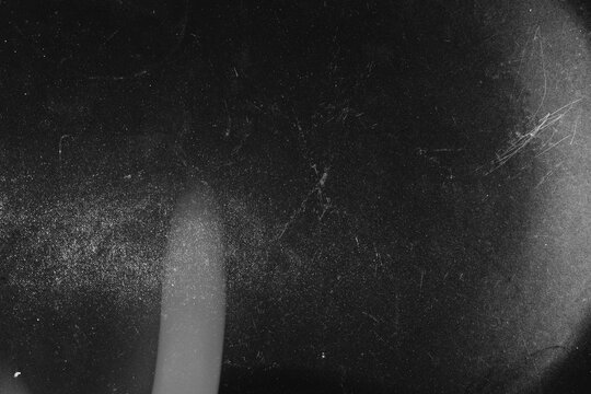 Old celluloid film overlay effect with vertical light flash scratches and heavy noise