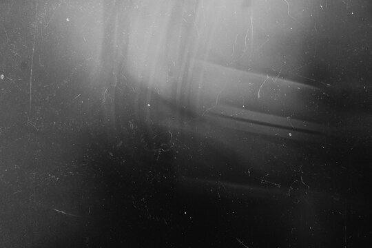 Soft ambient diagonal light gradient with retro dust and scratch overlay on a dark backdrop