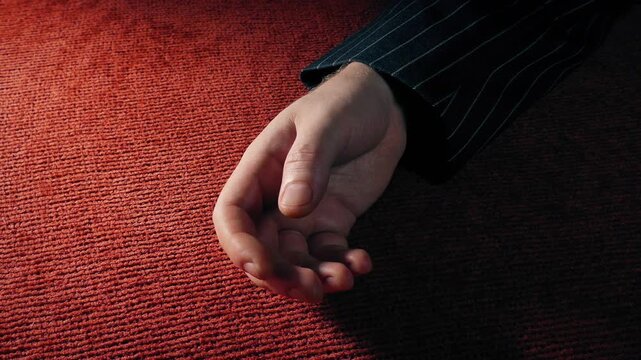 Man In Jacket Knocked Out Or Collapses On Carpet
