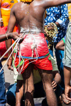 Man with hooks in his back during Thaipusam festival