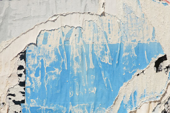 Old paper posters wall background. Creased crumpled paper placard, light blue, white, black colors