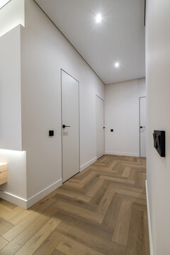 long empty corridor in interior of entrance hall of modern apartments, office or clinic