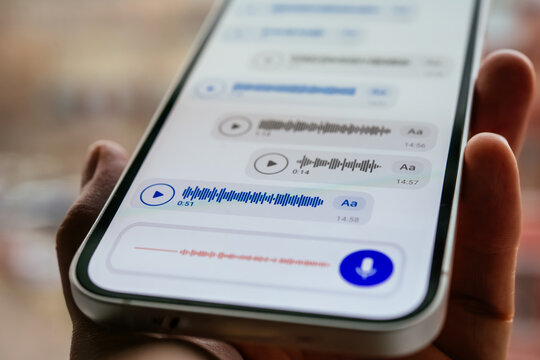 A person recording voice messages in a messenger.