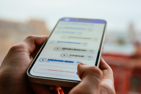 A person recording voice messages in a messenger.