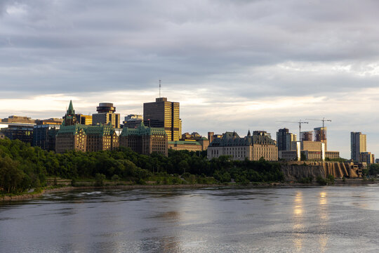 Ottawa city skyline with historic buildings along Ottawa River bank in Canada