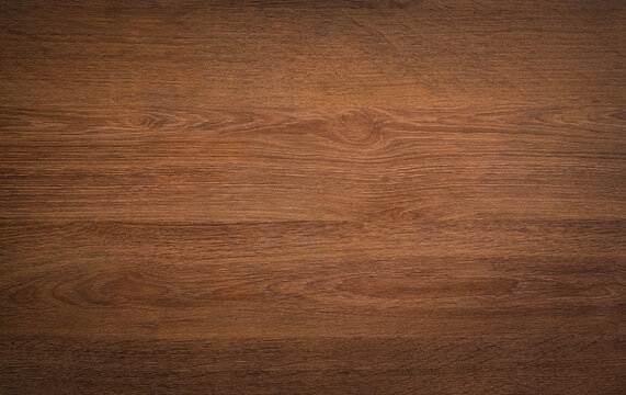 Dark wood background texture. Rustic wooden surface grain of deep brown board top view.