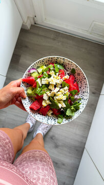 Person holding refreshing watermelon feta salad