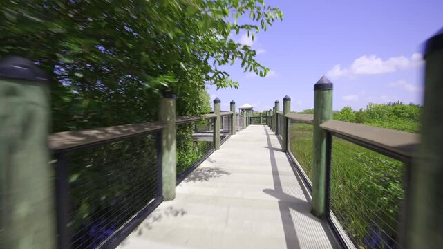 Gimbal motion video approaching a fresh water lake dock 4k HDR dolby
