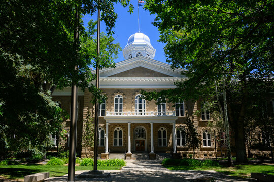 Carson City, NV, USA - June 21, 2026; Nevada State Capitol Building facade in landscaped grounds in summer