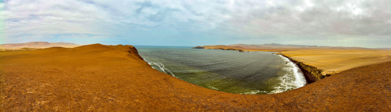 Peru, South America: breathtaking aerial and panoramic view of Playa Roja (Red Beach), one of the most famous beaches in the Paracas National Reserve, seen from the Mirador Istmo II viewpoint