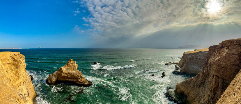 Peru, South America: breathtaking aerial and panoramic view of La Catedral (The Cathedral), one of the most iconic natural rock formations in the Paracas National Reserve, whose arch collapsed in 2007