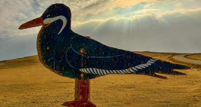 Peru, South America: a wooden sign depicting the zarcillo (Larosterna inca, the Inca tern), an iconic seabird found within the Paracas National Reserve, a protected natural area on the southern coast 