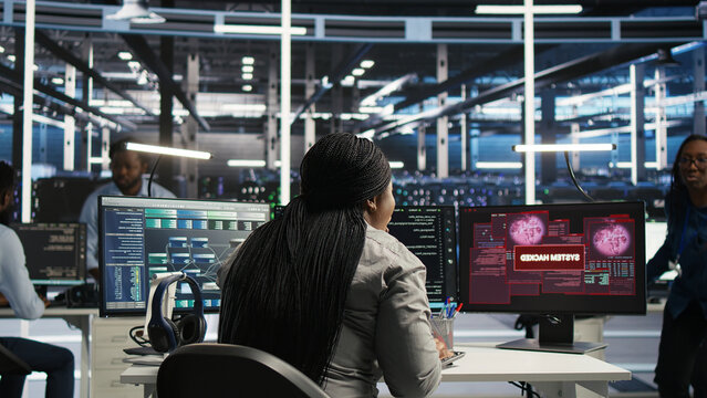 Data center engineering team react to a cyberattack on a computer, securing server equipment and protecting confidential data.