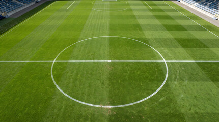 Obraz premium Vast Green Soccer Field with Center Circle and Goalposts