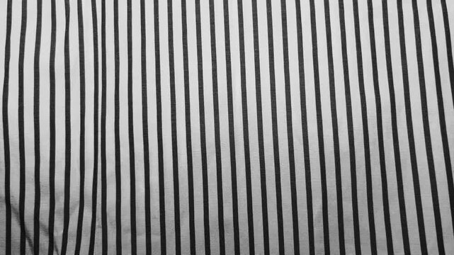 monochrome pinstripe fabric texture showcases clean minimalist aesthetic for sustainable fashion design background