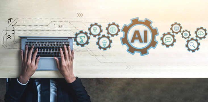 Hands typing on laptop with AI icons and digital elements on a desk, symbolizing technology, innovation, and artificial intelligence in modern business context. Entropy.