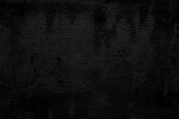 Textura de pared de hormigón grunge negro con grietas erosionadas. Superficie de pared envejecida oscura con grietas sutiles. Evoca misterio, decadencia y crudeza urbana. © C.Castilla