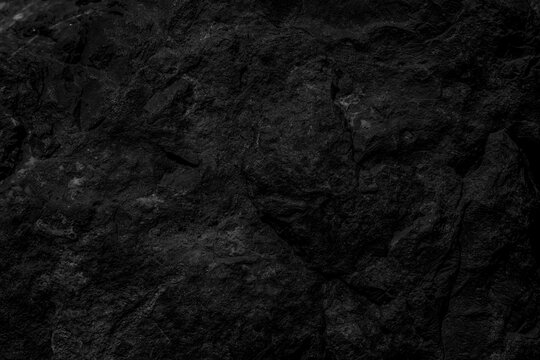  Textura de roca volc&aacute;nica negra, fondo natural oscuro y rugoso. Superficie de roca oscura y rugosa con textura natural. Evoca robustez, misterio y poder natural puro.