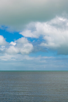 Calm horizon view at sea nature. Romantic summer vacation view on seascape. Sea horizon view. Cloudy sky and seascape at summer vacation. Skyscape with sea horizon. Travel destination