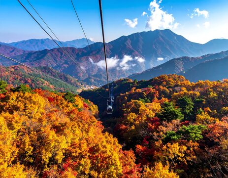 Cable Car Traversing Autumn Mountain Forest with Vibrant Foliage