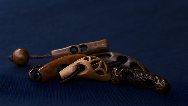Abstract Carved Wooden Netsuke Toggles on Dark Indigo Cloth