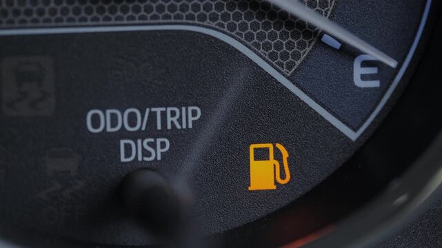 Low Fuel Warning Light Blinking on Car Dashboard, Empty Gas Tank Indicator