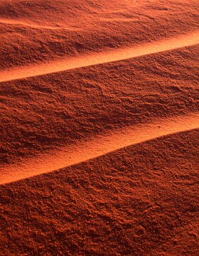 Red Sand Dunes with Shadow Patterns in Desert Landscape