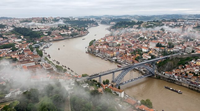 Aerial View of Porto and Douro River with Dom Luis I Bridge on a Cloudy Day.