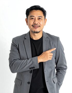 Smiling man in casual denim jacket outdoors portrait.
