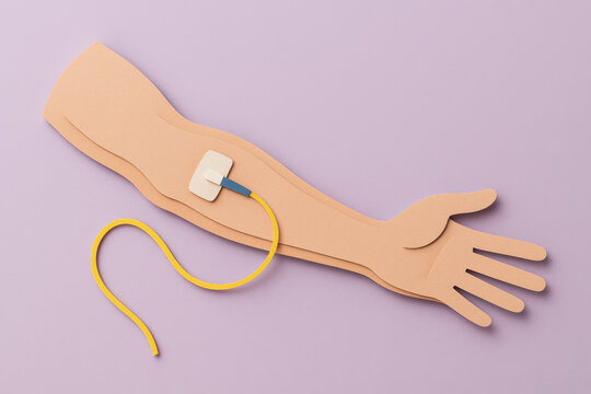 Paper craft forearm with needle and yellow tube, layered paper effect, soft shadow on lavender background, medical IV concept art