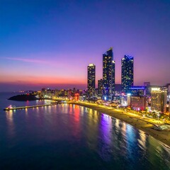 Naklejka premium Coastal City Skyline at Dusk with Reflections on Water