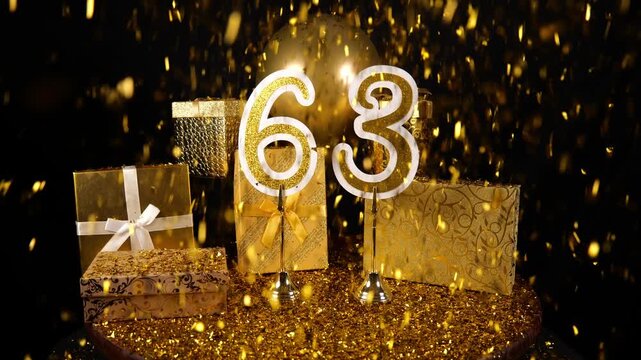 Gold Number 63 with Gold Glitter Confetti Sparkles with Gifts and Balloons for Party Sixty Three