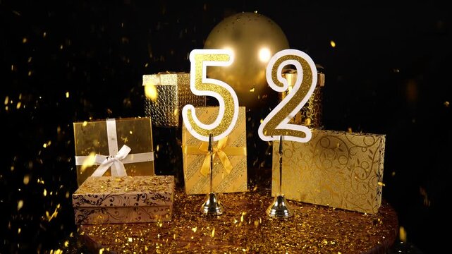 Gold Number 52 with Gold Glitter Confetti Sparkles with Gifts and Balloons for Party Fifty Two