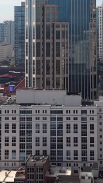Vertical format drone footage of the H5 Data Centers facility surrounded by downtown Nashville skyscrapers and commercial buildings