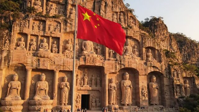 Chinese flag waving before ancient Buddhist Longmen Grottoes