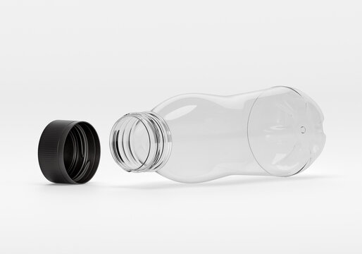 opened clear plastic bottle with detached black cap