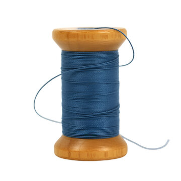 A single wooden spool of blue sewing thread with a loose tail for tailoring and craft projects