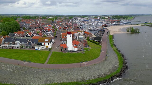 Urk lighthouse aerial view showing the old fishing village and harbor