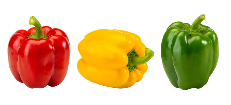Close-up of Three Whole Red Yellow Green Bell Peppers Arranged Horizontally on White Background