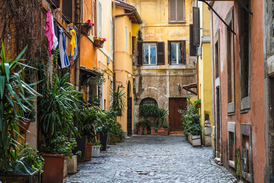 Picturesque alley with hanging laundry in Trastevere, Rome, Italy