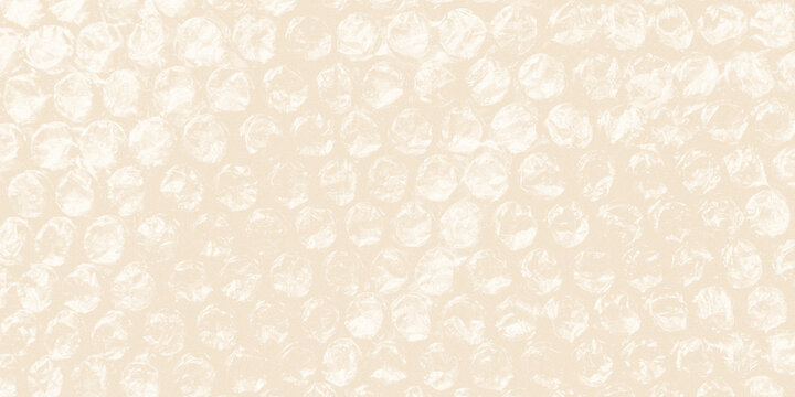 warm beige abstract wallpaper texture showing the repetitive, organic circles of transparent bubble wrap padding.