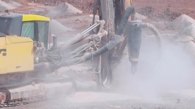 Drilling Rig Drilling Blast Holes at an Open Pit Mine During Surface Mining Operations