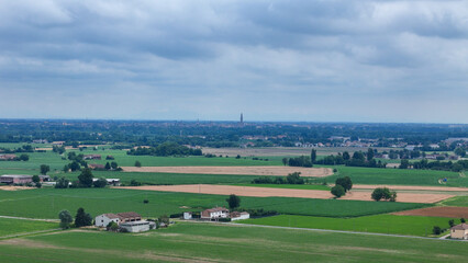 Naklejka premium Po Valley agriculture featuring extensive cultivated fields of cereal crops and farmland in the Emilia Romagna region of Italy