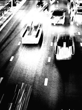 Black and White Aerial View of Traffic Road with Speeding Cars, High Contrast Motion Blur Street Photography