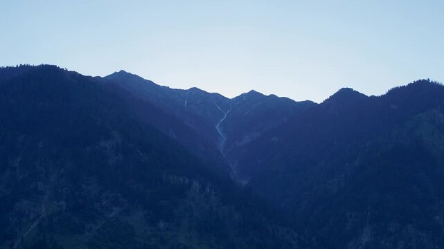 Early morning light reveals the rugged Hindu Kush mountain range above Kumrat Valley, Pakistan