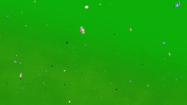 Particles drift slowly across a bright green screen background for digital compositing.