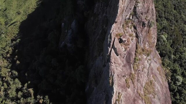 Pedra do Ba&uacute; in S&atilde;o Bento do Sapuca&iacute; in vertical video. Rock climbing site. Atlantic Forrest.
