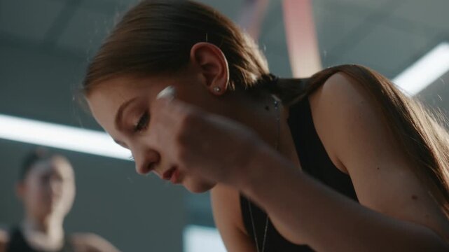 Teenage Athlete Struggling With Severe Self Pressure, Emotional Burnout. Girl Uses Bluetooth Headphones to Escape in Music and Suppress Panic. Strict Discipline Expected From Generation Z Competitors.