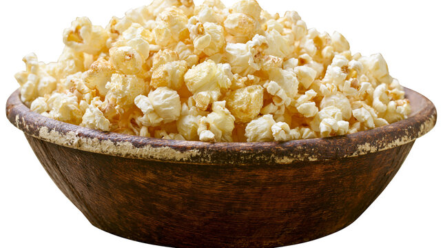 Rustic wooden bowl overflowing with fluffy popcorn, isolated on transparent background